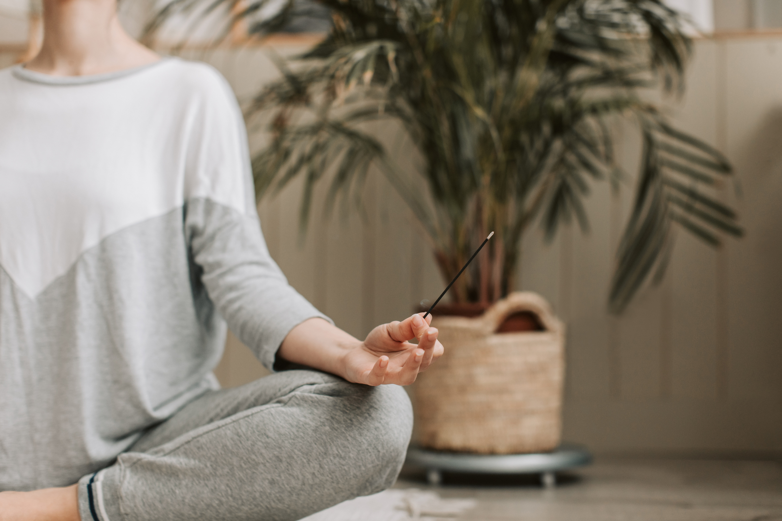 Person Holding an Incense