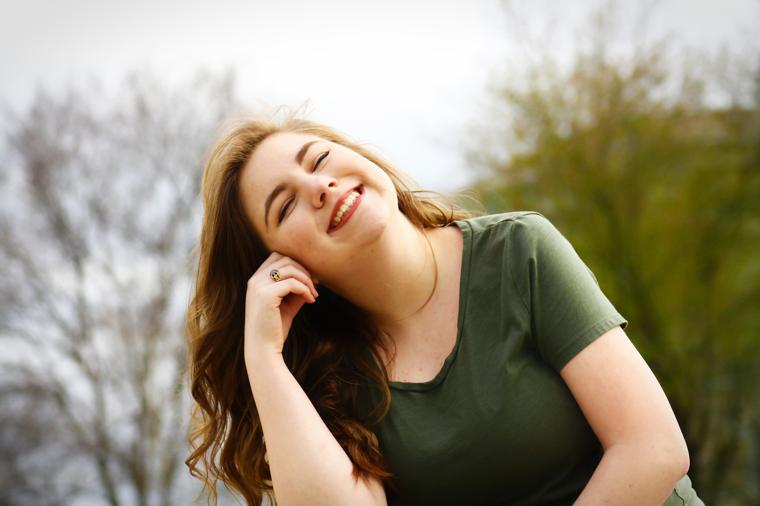 Woman in Green Shirt Smiling