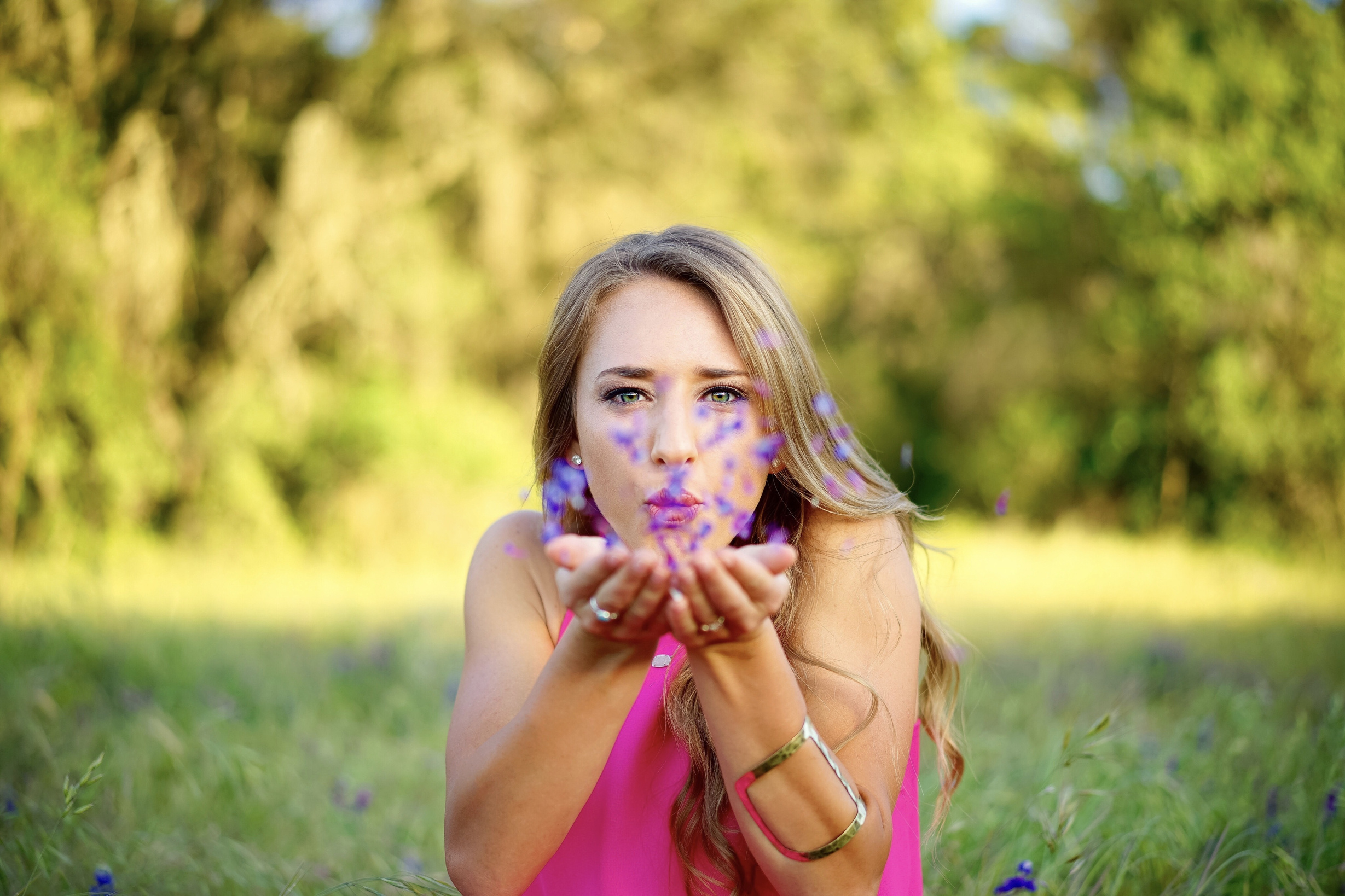 A Woman Blowing Flower Petals